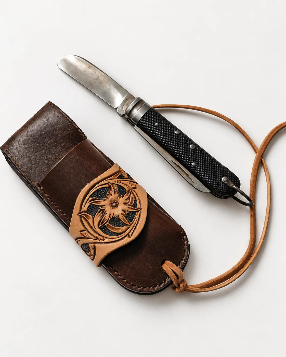 Small hand-carved leather sheath for a folding knife